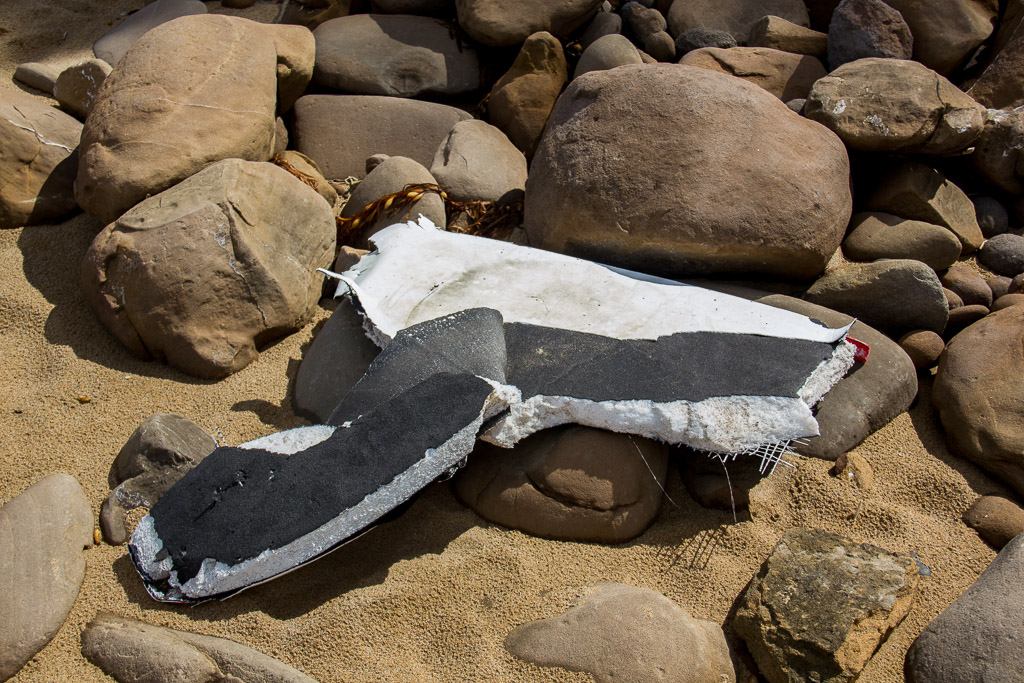 broken-foam-board-on-beach