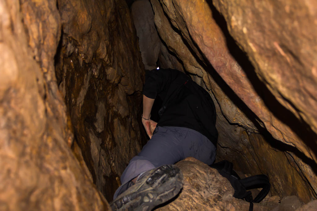 climbing-through-cave-wells-cathedrals