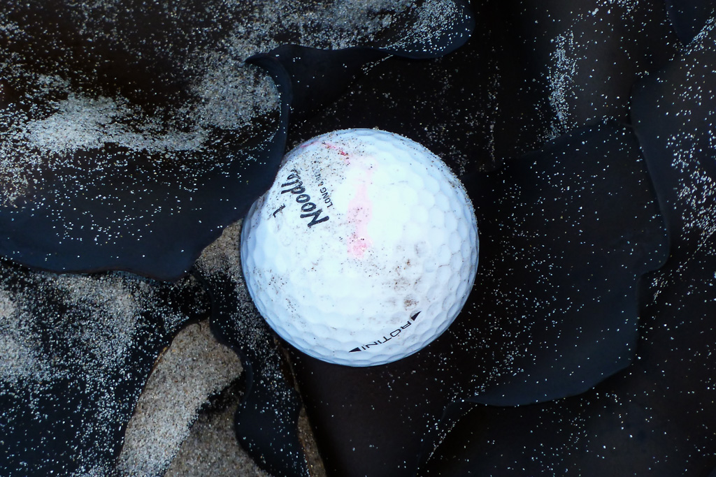 golf-ball-on-beach-seaweed