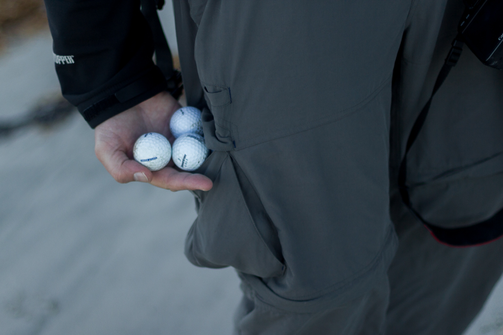 holding-golf-balls