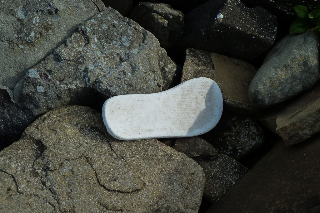 shoe-insole-on-rocks-beach