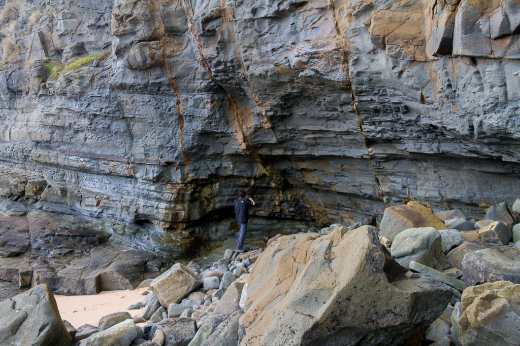 standing-under-cliffs-coast