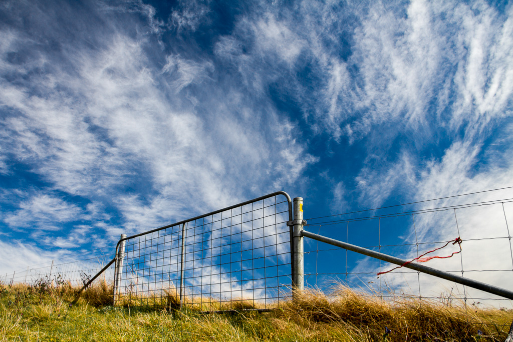 farm-gate-fence-polarised-sky