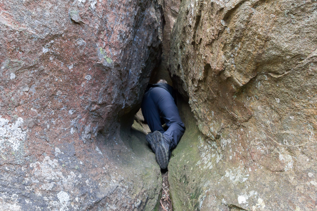 crawling-narrow-gap-between-boulder-hanging-rock