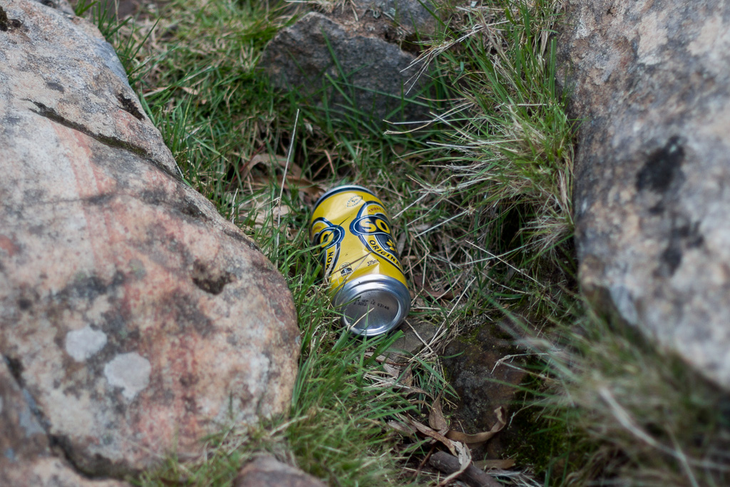 discarded-drink-can-hanging-rock