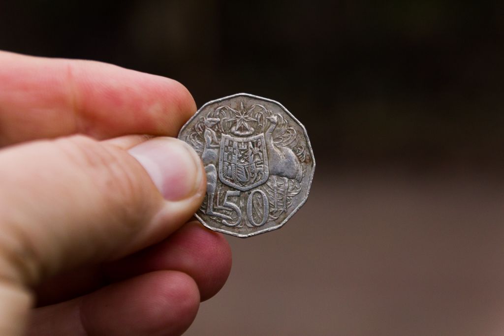 holding-50-cent-coin