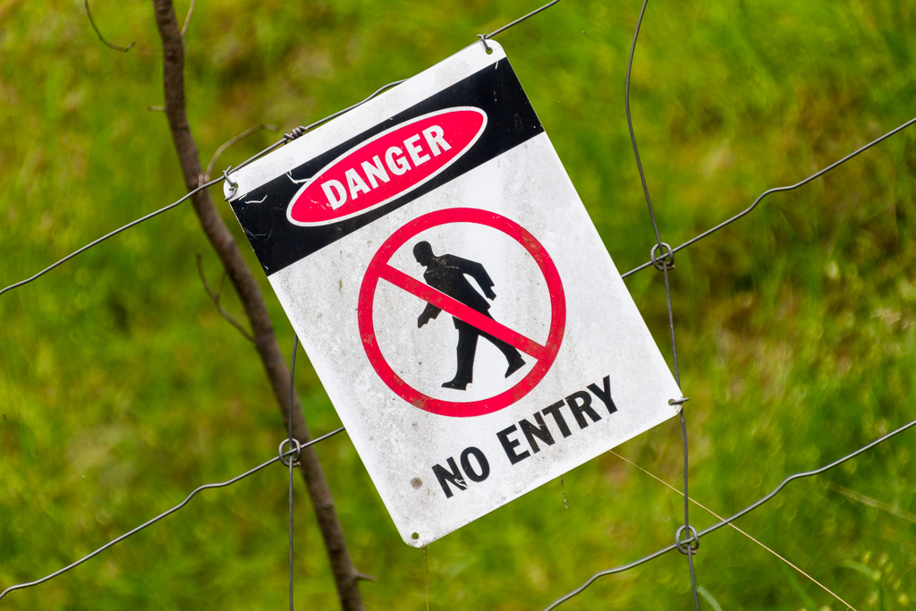 warning-sign-on-fence