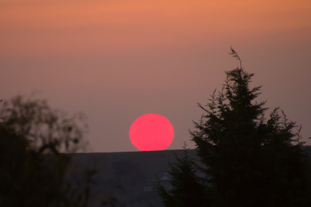 red-orb-sun-over-hill
