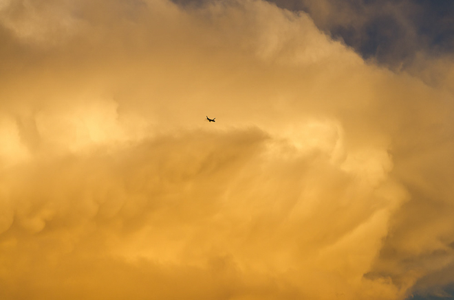 plane-sunset-cumulus-clouds