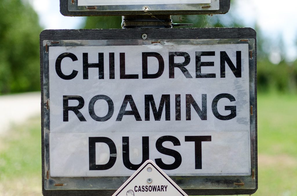 sign-children-roaming-dust