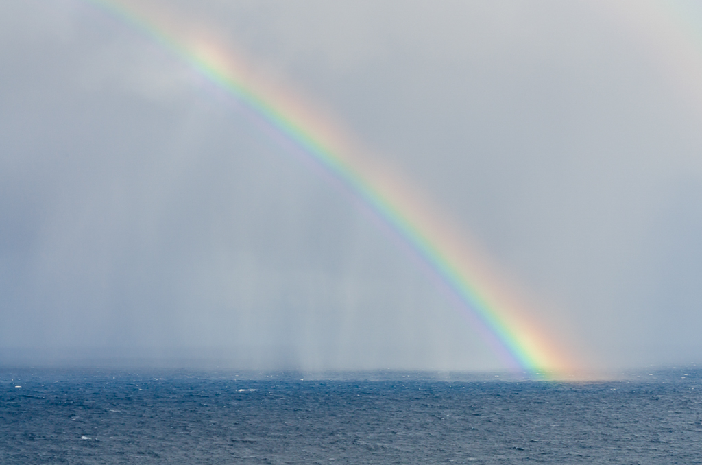 rain-and-rainbow-over-ocean