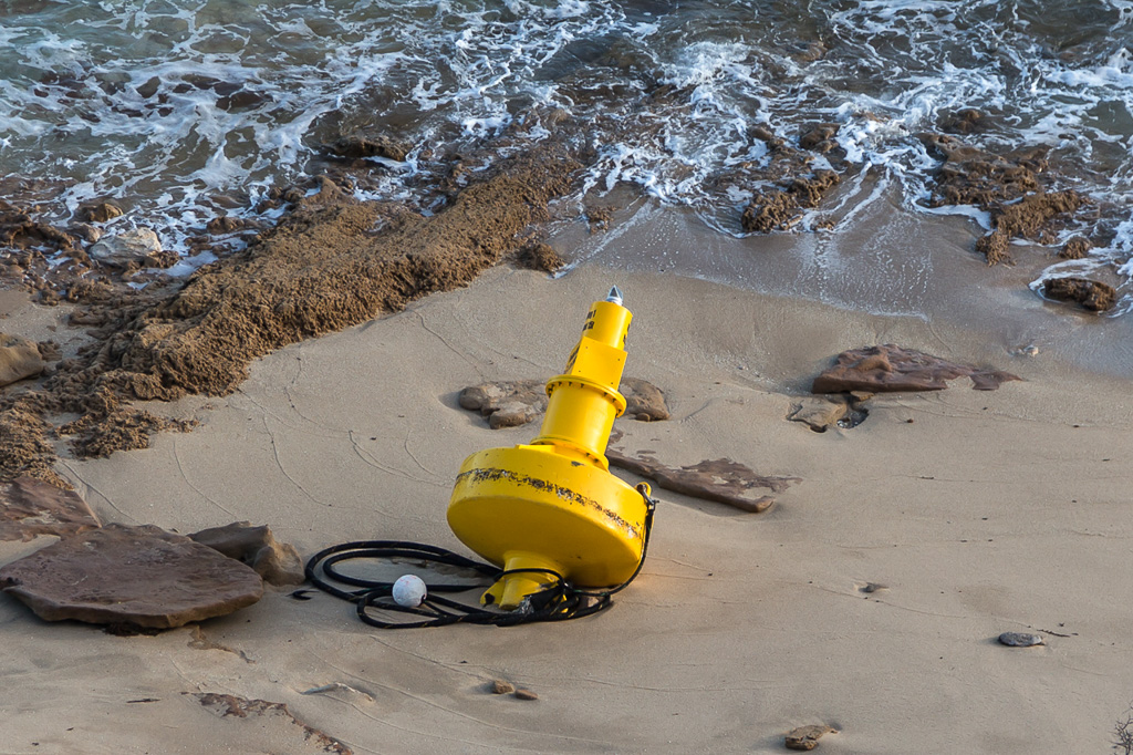 navigation-beacon-washed-up-on-beach