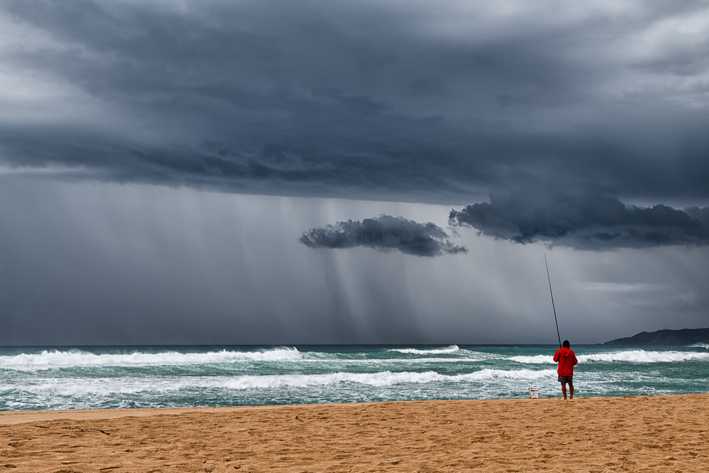 fishing-on-beach-storm