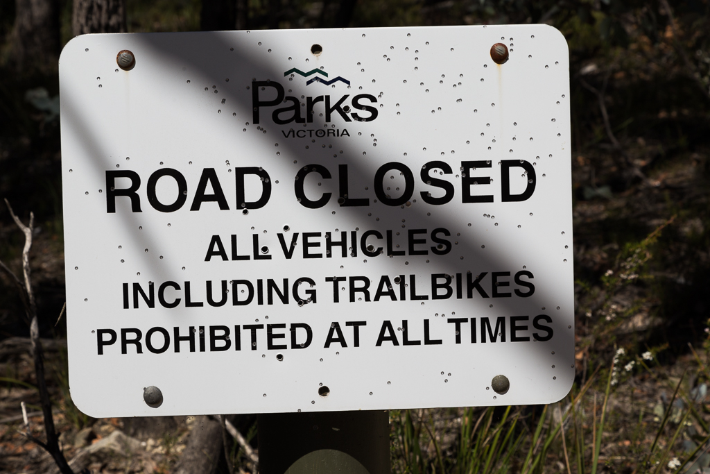 road-closed-sign-bullet-holes-lerderderg-state-park